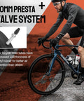 Cyclist riding a road bike highlighting 60mm Presta valve, part of 2 Pack 700x23-25c Road Bike Inner Tubes With 60mm Presta Valve, Premium Butyl Rubber.