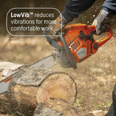 Person using Gas Chainsaw 18 Inch 50cc 3-HP X-Torq Engine with Automatic Oiler for chopping wood.