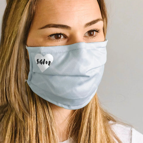 Woman wearing custom mask with heart design using Stretchable Heat Transfer Paper For Light Fabrics Inkjet Printer Ready.