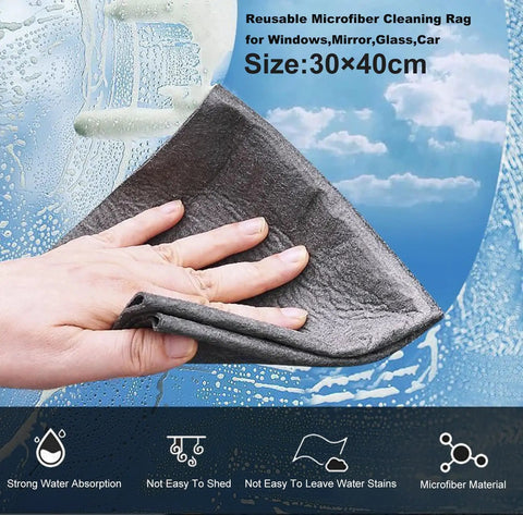 Hand using 30x40cm microfiber cleaning rag on a window, showcasing water absorption; part of Dual Spring Automatic Greenhouse Window Opener Kit For Roof Vents With Solar Heat Sensitive Actuation, No Fuss Temperature Activated Ventilation, Rust Resistant Aluminum Build, Includes Microfiber Cleaning Rag Set For Easy Maintenance.