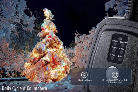 Super Tough Weatherproof Remote Outlet Power Strip With 100 Foot Wireless Range Dual Sockets Plug In Timer For Yard Lights And Pool Pump, black outlet with timer next to snow-covered Christmas tree.