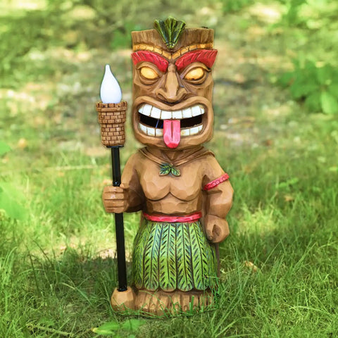 Flickering Tiki Torch Solar Light For Outdoor Decor standing on grass, 14.5-inch polyresin statue with realistic LED flame