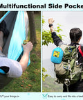 Man reclining in a Versatile Camping Hammock For One Or Two Portable And Lightweight Includes Two Tree Straps And Built In Carry Bag Totally Great For Outdoor Indoor Beach And Camping Supports Up To 400 Lbs Easy Setup And Tree Friendly Straps with drink in hand.