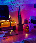 Ark Lite LED Aurora Projector with Laser Nebula and Galaxy Lighting in a game room setting with ambient light effects.