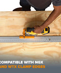Person using Clamp Edge Jigsaw Guide For Straight Cuts And Steady Tracking, Fits Most Jigsaws, on wooden board.