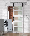 Diagram showing details of Pretty Dang Sleek Modern Glass Barn Door 36 By 84 Inches for Private Rooms, with track and clearance measurements.