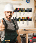 Man in workshop with 2 Pack Wall Mount Screwdriver And Pliers Organizer Rack Heavy Duty Steel Tool Holder For Garage on wall.