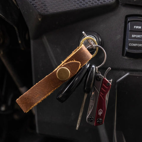 12 In 1 EDC Multitool With Needle Nose Pliers, Wire Cutters, Tweezers, Bottle Opener, Package Opener on keychain in ignition