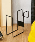 Two Pack Steel Hard Hat Rack For Trucks Over The Seat, black, shown with a drill and yellow hard hat