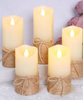 Flickering Flameless Candles Set Of 5 Battery Pillar Candles With Timer, hemp rope wrapped, on table with pink flowers