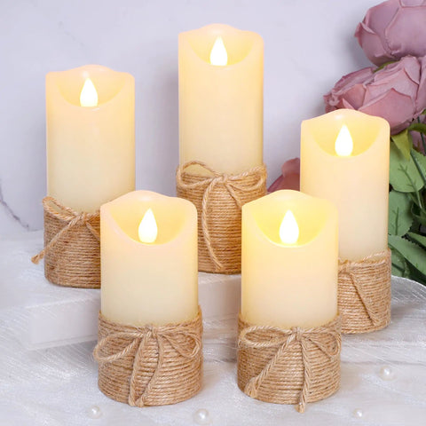 Flickering Flameless Candles Set Of 5 Battery Pillar Candles With Timer, hemp rope wrapped, on table with pink flowers