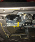 Inside view of Heavy Duty Universal Car Power Door Lock Kit featuring actuators and mounting components for easy installation.