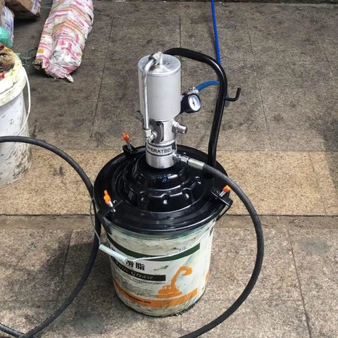 Portable 5 Gallon High Pressure Pneumatic Grease Pump Kit with follower plate on pavement