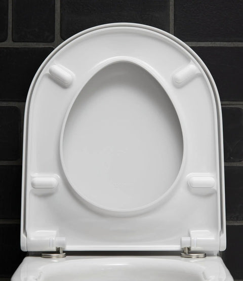 Slick Starck 3 White Toilet Seat With Smooth As Butter Soft Close Hinges top view showing designer contour and hinges.
