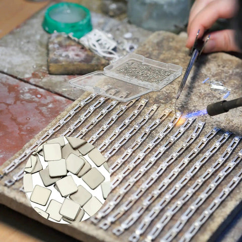 Jewelry maker using Three Gram Silver Chip Solder For Jewelry Making Precut 2x2 mm Flux Chips for precise fine metalwork repairs.