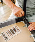 Person assembling furniture using 49Pcs M6 40 To 80Mm Hex Socket Head Screws And Barrel Nuts Grab And Go Kit