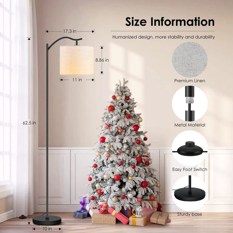 Arched LED Floor Lamp With Beige Linen Shade Slick Modern Mid Century Standing Lamp Black Finish Built In Footswitch Ideal For Living Room Bedroom Study Or Office E26 Base Socket Bulb Not Included Durable Steel Construction next to a decorated Christmas tree