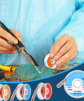 Person using solder wick desoldering braided solder braid set 1.5 meter length low residue copper wicks on circuit board.