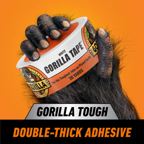 Heavy Duty White Duct Tape 1.88 Inch Wide, 30 Yard Roll Pack Of 2, UV Resistant in a gorilla hand against an orange background
