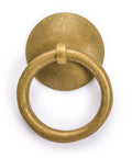 Close-up of brass Chinese medicine cabinet pull showing round design for architectural interior design and furniture customization.