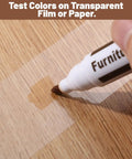 Easy Peasy Wood Furniture Repair Kit Featuring Six Realistic Tone Touch Up Markers And Wax Sticks For Quick Scratch Dent And Nail Hole Fixin On Tables Chairs And Cabinets demonstration with a wood tone marker testing color on a wood surface.