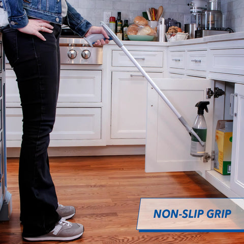 Unger 32-inch Grabber Plus Reacher Tool with built-in magnet; gray handle, white shaft reaching from kitchen cabinet.