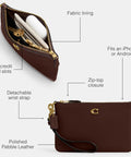 Top Shelf Small Wristlet Crafted From Smooth Pebble Leather With Signature Hardware And Detachable Strap For Phone Cash Cards Everyday Carry Clean Fit Women Fashion Clutch Case showing interior slots and zip-top.