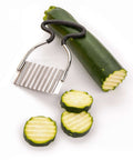 RSVP Endurance crinkle-cutting tool with black rubber handle and stainless steel blade, shown with zucchini slices.
