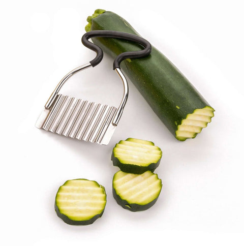 RSVP Endurance crinkle-cutting tool with black rubber handle and stainless steel blade, shown with zucchini slices.