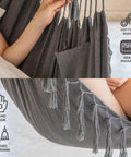Close-up of hammock chair material with cotton rope and side pocket, showing tassel macrame, handmade design. Dark Gray fabric.
