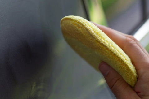 Using Microfiber Polishing Pads Set For Car Detailing 5 Inch Yellow 6 Pack Ultra Soft Cleaning Pads on car surface