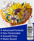Hand holding stained glass with 4oz Liquid Zinc Solder Flux For Stained Glass Soldering And Repairs Water Based Formula bottle
