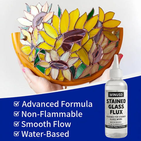 Hand holding stained glass with 4oz Liquid Zinc Solder Flux For Stained Glass Soldering And Repairs Water Based Formula bottle