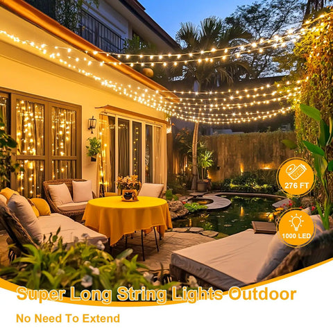 Patio illuminated with 1000 LED Warm White Christmas String Lights With Remote, Epic 272 Feet Total Length, 8 Modes, Plug In