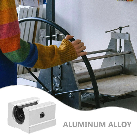Person operating industrial equipment with Two Pack Linear Guide Sliders Aluminum Alloy Blocks visible in the foreground.