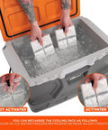Hands placing ice packs for Cooling Vest With Four Ice Packs, Ultra Lightweight, Fast Recharge Cooling, Black, Small Medium in cooler