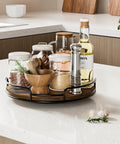 9 Inch Wooden Lazy Susan Organizer With 360 Degree Rotation for spices and kitchen staples on a countertop.