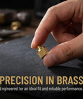 Professional Grade Beefy Brass Refrigeration Valve Caps With Slick Knurled Nozzles For Ac Systems And Coolant Lines Leak Proof Field Service Covers No Sweat Maintenance 30 Pack shown held in hand.