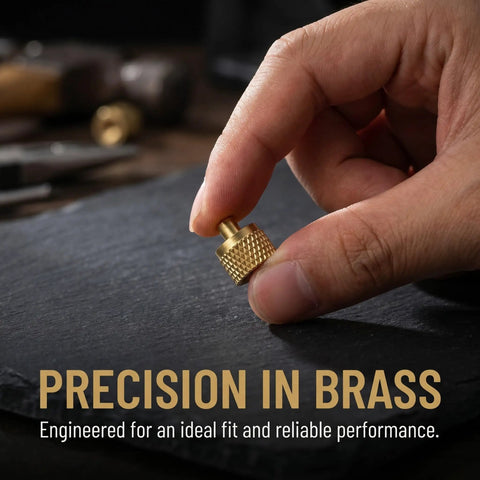 Professional Grade Beefy Brass Refrigeration Valve Caps With Slick Knurled Nozzles For Ac Systems And Coolant Lines Leak Proof Field Service Covers No Sweat Maintenance 30 Pack shown held in hand.