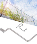 Steel Fence Wire Tightener 20 Pieces Kit With Tightening Handle shown against a background of outdoor fencing with sky and grass.