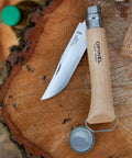 Killer Stainless Steel Folding Pocket Knife With Integrated Wine Corkscrew And Bottle Opener Solid Beechwood Handle on wood.