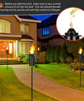 16 Ounce Torch Replacement Canisters for Refillable Bamboo Torch Fuel Citronella Tabletop Torches Outdoor Patio Garden Decor Black No Fuss Easy Pour Wide Mouth Design with Snuff Cap for Safe Extinguishing shown lit in garden pathway