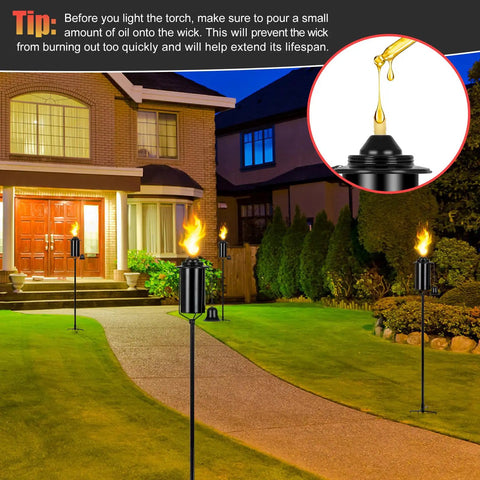 16 Ounce Torch Replacement Canisters for Refillable Bamboo Torch Fuel Citronella Tabletop Torches Outdoor Patio Garden Decor Black No Fuss Easy Pour Wide Mouth Design with Snuff Cap for Safe Extinguishing shown lit in garden pathway