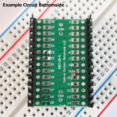SMD To DIP Breakout PCB Module With SOIC 28 To DIP Adapter, dual row header on breadboard, 28 pin wide, bottom view.
