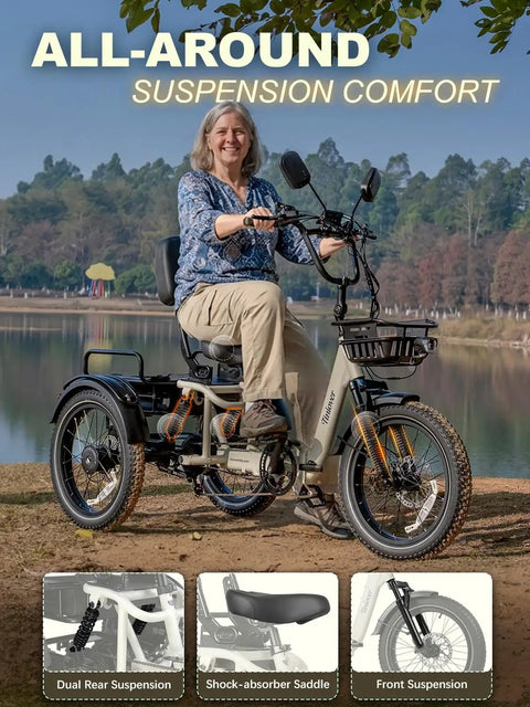 Full Suspension Folding Electric Tricycle For Adults With 1200W 48V 20Ah Power, 20 MPH Top Speed, 100 Mile Range, 20x3 Fat Tires, Reverse, Parking, Differential, White, Premium Seat And Rear Storage Box For A Beast Ride. Rider on white trike by lake