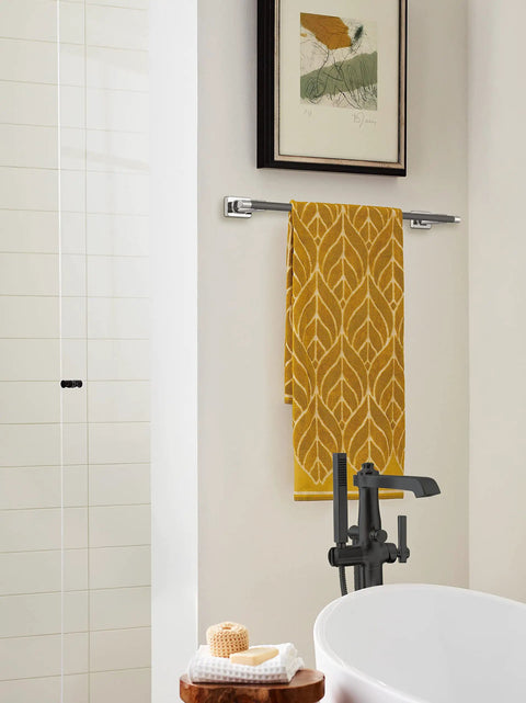 Bathroom with Dope 24 Inch Towel Bar In Polished Nickel Gunmetal Finish For Bathrooms Esquire Style Towel Rack holding a yellow towel.