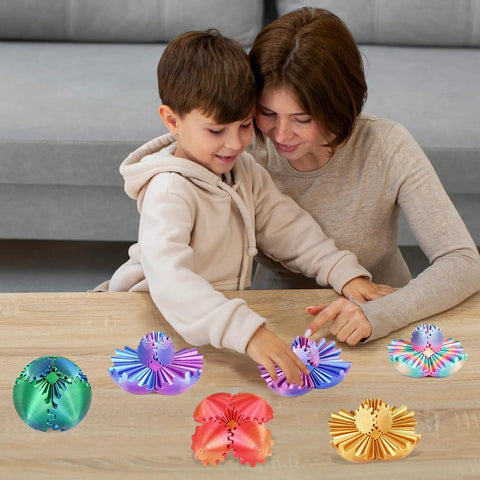 Mother and child playing with colorful 3D Printed Gear Sphere Fidget Toy For Sensory Stress Relief And Chill on a wooden table