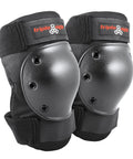 Black knee pads with hard shell designed for skaters and snowboarders, featuring ventilated EVA foam and durable fabric with elastic straps.
