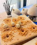 EssEthmy 60W Mini Metal Wood Lathe, Precision Bead Turner with crafted wooden beads and shavings on a work surface.
