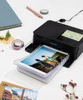 Selphy CP1500 Wireless Photo Printer In Black Ultra Portable Mini Printer With WiFi And Smartphone Connectivity printing a photo
